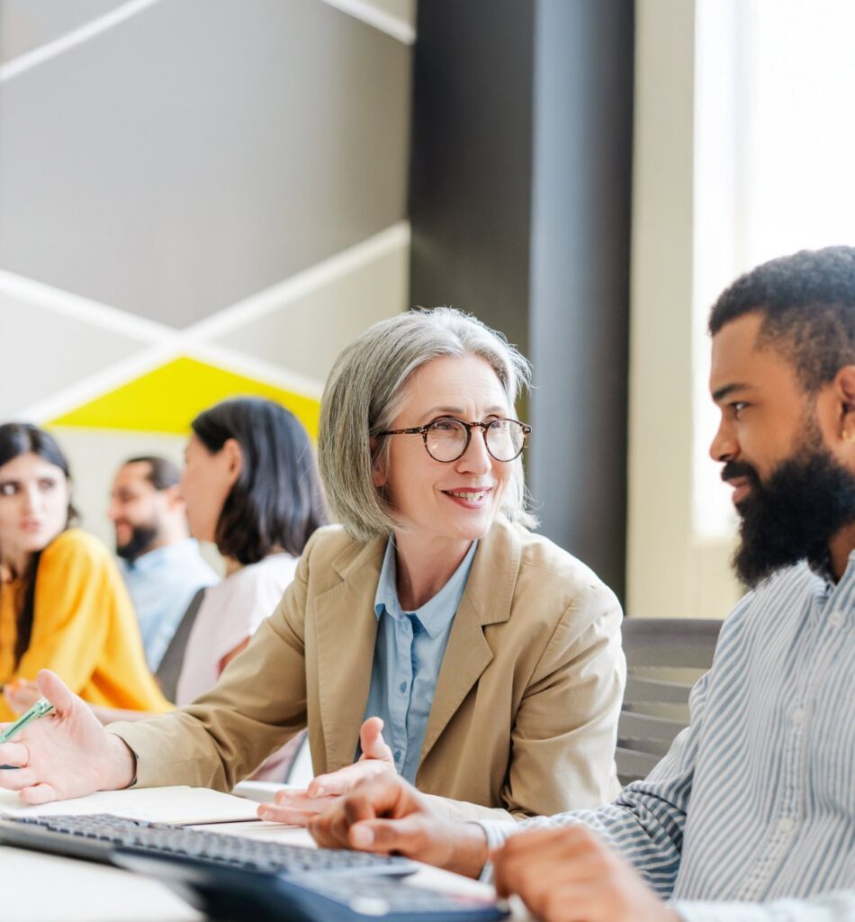 People seated at a table, talking